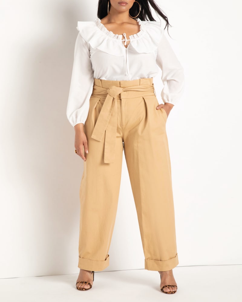 Front of a model wearing a size 14 Khloe Ruffle Blouse in Soft White by ELOQUII. | dia_product_style_image_id:204118